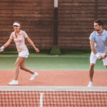 Couple playing tennis