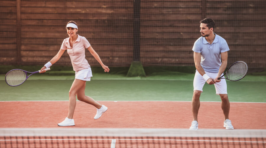 Couple playing tennis