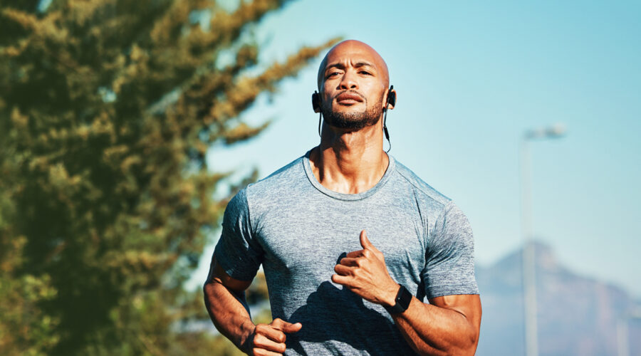 man running earphones during at hot summer day